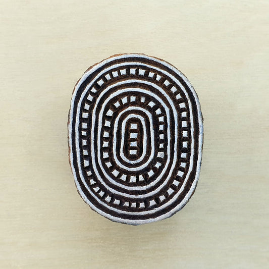 Small oval wood stamp.