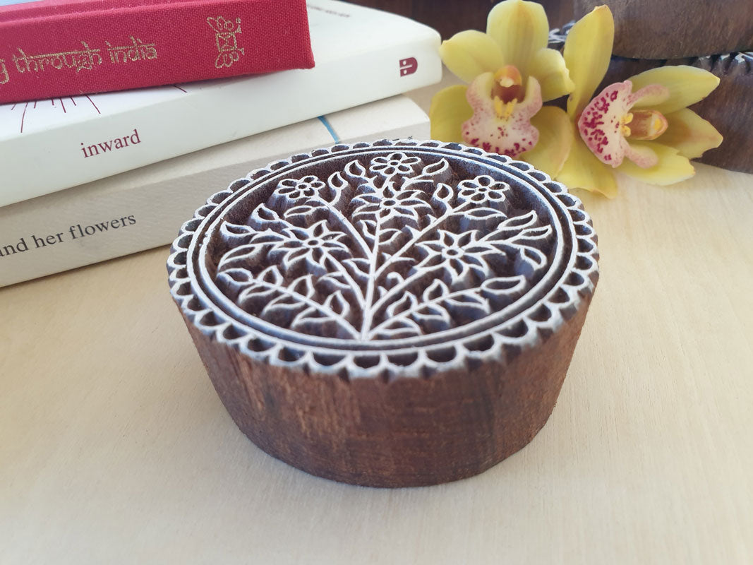 Round floral wood stamp.
