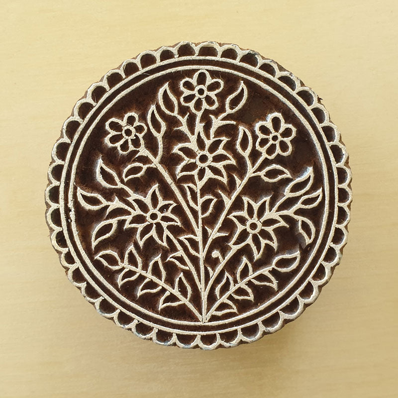 Round floral wood block stamp.