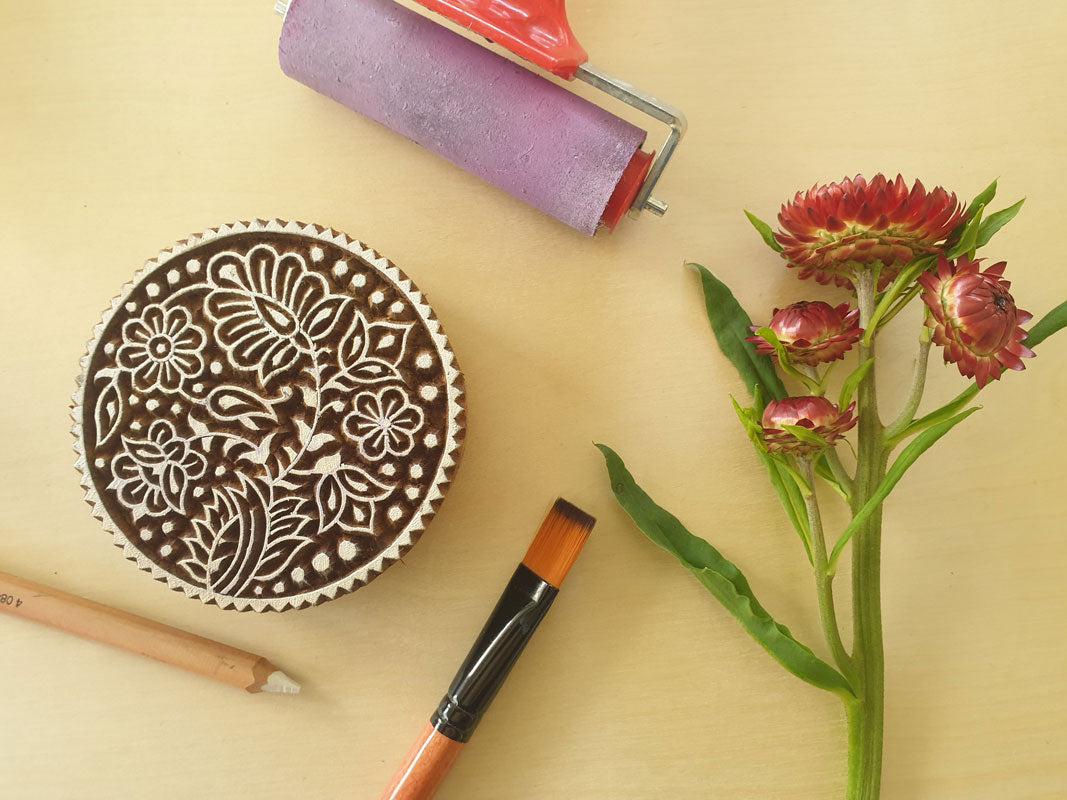 Round floral wood block stamp.